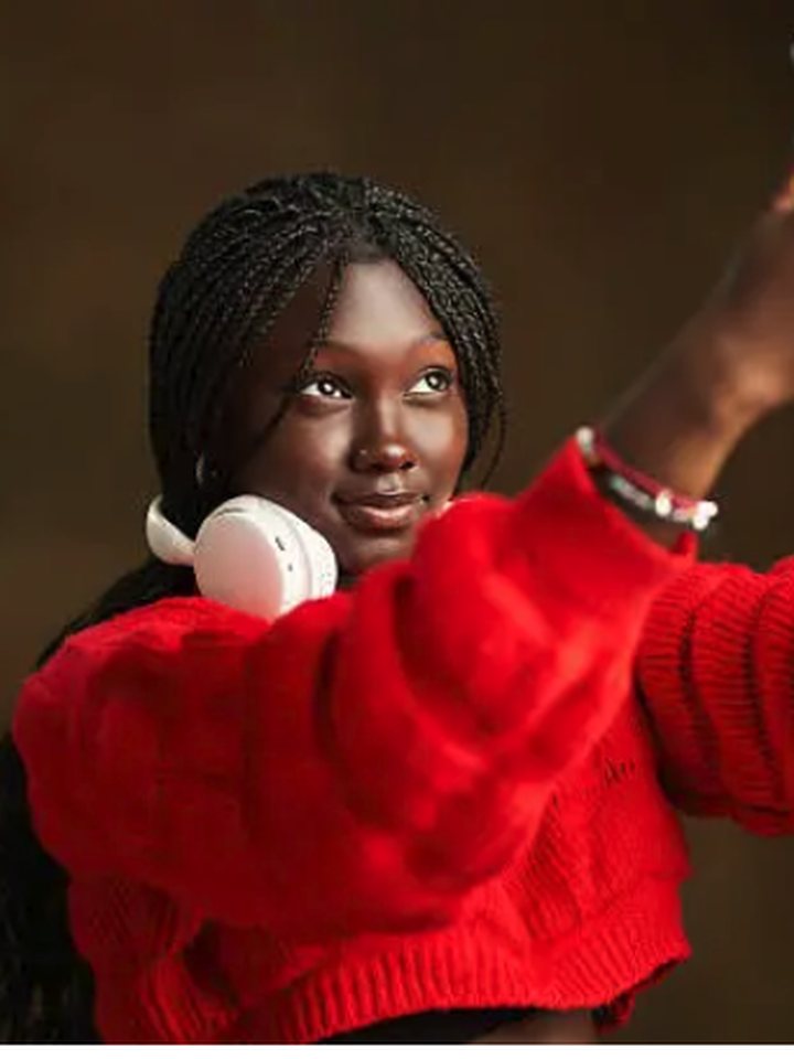 A creator filming a piece to camera on her phone